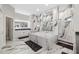 Luxurious bathroom features a soaking tub surrounded by marble and a dual sink vanity at 19006 69Th E Ave, Bradenton, FL 34211