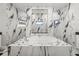 Luxurious bathroom features a soaking tub surrounded by marble and unique tile accents at 19006 69Th E Ave, Bradenton, FL 34211