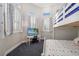 Bright bedroom with bunk bed, desk, and two sunny windows at 19006 69Th E Ave, Bradenton, FL 34211