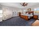 Spacious bedroom featuring a ceiling fan, and a cozy sitting area to enjoy a book at 19006 69Th E Ave, Bradenton, FL 34211