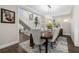 Elegant dining room showcases a chandelier, staircase, and a large dining table at 19006 69Th E Ave, Bradenton, FL 34211