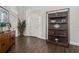 Inviting foyer features beautiful wood floors, display shelving and a glass-paneled front door at 19006 69Th E Ave, Bradenton, FL 34211