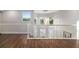 Second floor hallway with wood floors and natural light showcasing the home's open layout at 19006 69Th E Ave, Bradenton, FL 34211