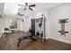 Spacious home gym featuring modern equipment, ceiling fans, and natural light at 19006 69Th E Ave, Bradenton, FL 34211