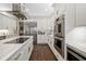 Stylish kitchen featuring stainless steel appliances and a large central island with modern cooktop at 19006 69Th E Ave, Bradenton, FL 34211