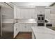 Spacious kitchen with white cabinetry, stainless steel appliances, and luxurious countertop at 19006 69Th E Ave, Bradenton, FL 34211