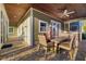 Covered outdoor dining area and kitchen with brick pavers at 19006 69Th E Ave, Bradenton, FL 34211