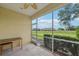 Covered screened patio offering pleasant outdoor space with views of the lush surroundings at 2353 Rosewood Ln, North Port, FL 34289