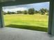 Backyard view featuring a beautiful yard and green grass at 25 Sabot Ct, Placida, FL 33946
