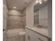 Updated bathroom featuring granite countertop vanity, tile shower, and modern fixtures at 25 Sabot Ct, Placida, FL 33946
