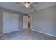 A bedroom featuring tile floors and large closets with sliding doors at 25 Sabot Ct, Placida, FL 33946