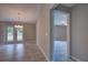 Hallway leading to a room with backyard access, showcasing the tile flooring and open layout at 25 Sabot Ct, Placida, FL 33946