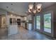 Well-lit kitchen and breakfast area with granite countertops, stainless steel appliances and backyard views at 25 Sabot Ct, Placida, FL 33946