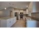 Stylish kitchen boasting stainless steel appliances, granite countertops, and a spacious island at 25 Sabot Ct, Placida, FL 33946