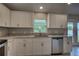 Contemporary kitchen with stainless steel appliances, granite counters, and ample counter space at 25 Sabot Ct, Placida, FL 33946