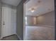 Bright open-concept living room features neutral gray walls, tile floors, and a ceiling fan at 25 Sabot Ct, Placida, FL 33946