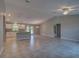 Bright, open-concept living space with tile floors, high ceilings, and modern lighting fixtures at 25 Sabot Ct, Placida, FL 33946