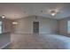 Spacious living area with vaulted ceilings seamlessly connecting to the modern kitchen at 25 Sabot Ct, Placida, FL 33946