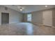 Inviting living area with a large window, neutral color palette, and tile flooring at 25 Sabot Ct, Placida, FL 33946