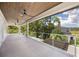 Expansive balcony with wood ceilings and scenic views of the surrounding neighborhood at 2596 Floyd St, Sarasota, FL 34239