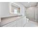 Bathroom vanity with modern cabinetry, quartz countertop and stylish mirror at 2596 Floyd St, Sarasota, FL 34239