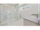 Modern bathroom featuring a glass-enclosed shower and sleek vanity at 2596 Floyd St, Sarasota, FL 34239