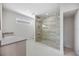 Modern bathroom featuring a glass-enclosed shower, sleek vanity, and contemporary fixtures at 2596 Floyd St, Sarasota, FL 34239