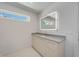 Bathroom vanity with modern cabinetry, quartz countertop and stylish mirror at 2596 Floyd St, Sarasota, FL 34239