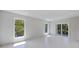 Bright bedroom with large windows and a sliding door for seamless indoor-outdoor living at 2596 Floyd St, Sarasota, FL 34239