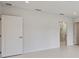 Bright bedroom with white walls, recessed lighting, and doorways to other rooms at 2596 Floyd St, Sarasota, FL 34239