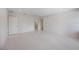 A minimalist designed bedroom features white walls and floors, enhancing spaciousness and light at 2596 Floyd St, Sarasota, FL 34239