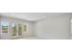 Bright bedroom with French doors leading to a balcony and great views at 2596 Floyd St, Sarasota, FL 34239
