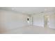 Bright bedroom with white walls, recessed lighting, and doorways to other rooms at 2596 Floyd St, Sarasota, FL 34239