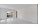 Bright bedroom with white walls, recessed lighting, and sliding doors to a balcony at 2596 Floyd St, Sarasota, FL 34239