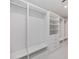 Spacious walk-in closet with custom shelving and drawers for optimal organization and storage at 2596 Floyd St, Sarasota, FL 34239