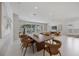 Open concept living featuring views to the living room and the outdoor space beyond at 2596 Floyd St, Sarasota, FL 34239