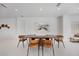 This dining area is well lit and features seating for six with neutral artwork and decor at 2596 Floyd St, Sarasota, FL 34239