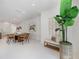 Dining area with modern table and chairs, stylish decor, and open to the living space at 2596 Floyd St, Sarasota, FL 34239