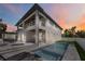 Stunning two-story home with a private pool, covered patio, and balcony for outdoor relaxation at 2596 Floyd St, Sarasota, FL 34239