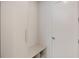 Hallway with bench and a door at 2596 Floyd St, Sarasota, FL 34239