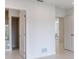 Bright hallway with white walls and baseboards provides access to other rooms at 2596 Floyd St, Sarasota, FL 34239