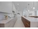 A modern kitchen boasts ample counter space and seamless integration with the living and dining areas at 2596 Floyd St, Sarasota, FL 34239