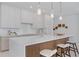 This modern kitchen features a large island, beautiful countertops, and stylish pendant lighting at 2596 Floyd St, Sarasota, FL 34239
