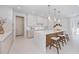 Beautiful kitchen featuring an island with chairs and lots of cabinets for storage at 2596 Floyd St, Sarasota, FL 34239