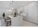 Stylish kitchen features a large center island, pendant lights, and breakfast bar with seating at 2596 Floyd St, Sarasota, FL 34239