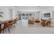 Spacious living room showcases open concept living with access to outdoor space and dining area at 2596 Floyd St, Sarasota, FL 34239