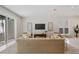 Comfortable living space with a tan sofa, modern decor, and plenty of natural light at 2596 Floyd St, Sarasota, FL 34239