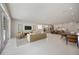 Spacious living room with open layout, modern kitchen, dining area, and comfortable seating at 2596 Floyd St, Sarasota, FL 34239