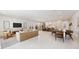 Open-concept living area with a modern kitchen, dining space, and comfortable seating area at 2596 Floyd St, Sarasota, FL 34239