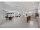 Bright and open living space showcasing a kitchen, dining area, and cozy seating for seamless entertaining at 2596 Floyd St, Sarasota, FL 34239